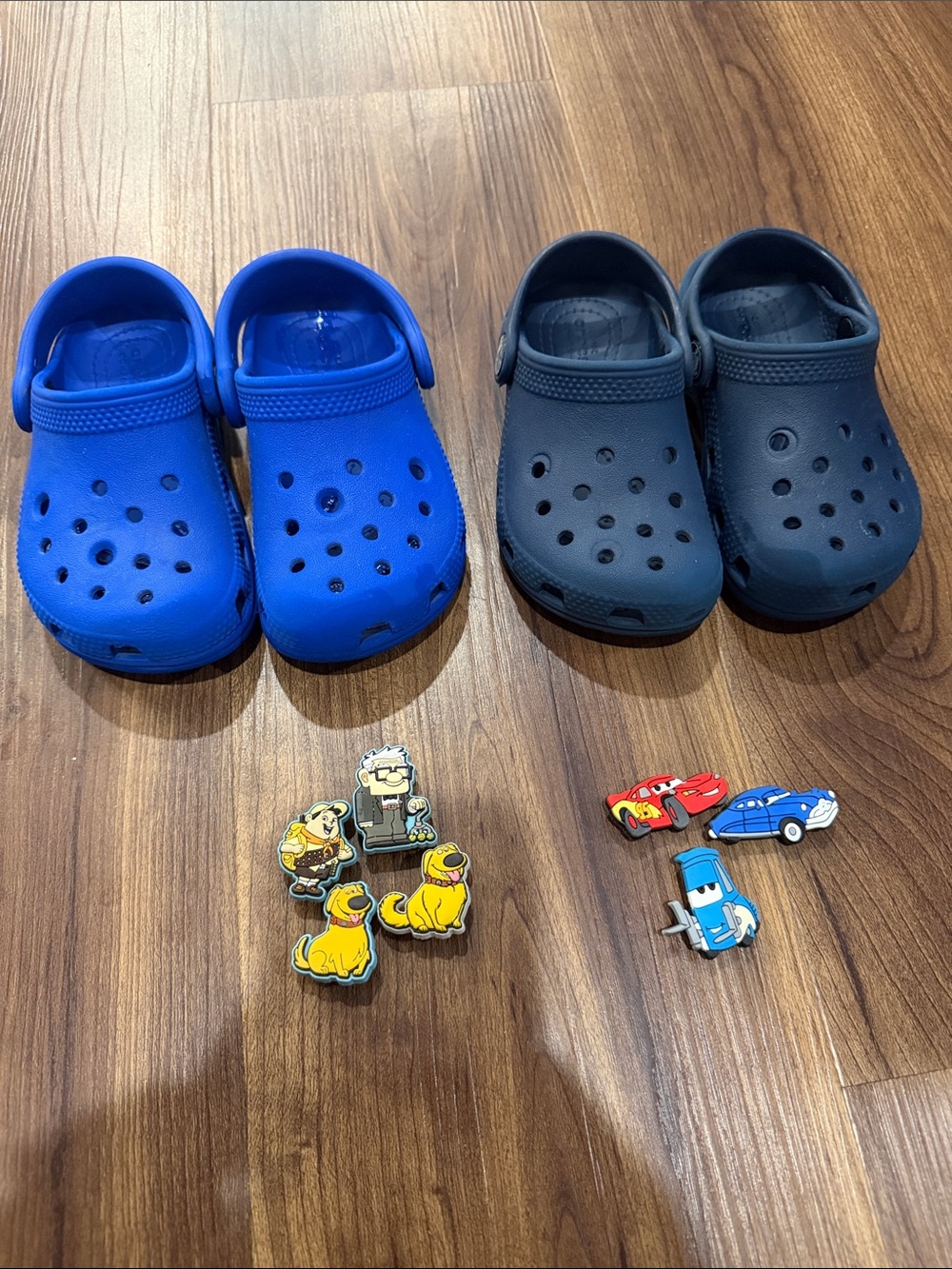 Two (2) pair of Blue Crocs - size 8 with Disney Croc Charm Jibbitz - Gently Used